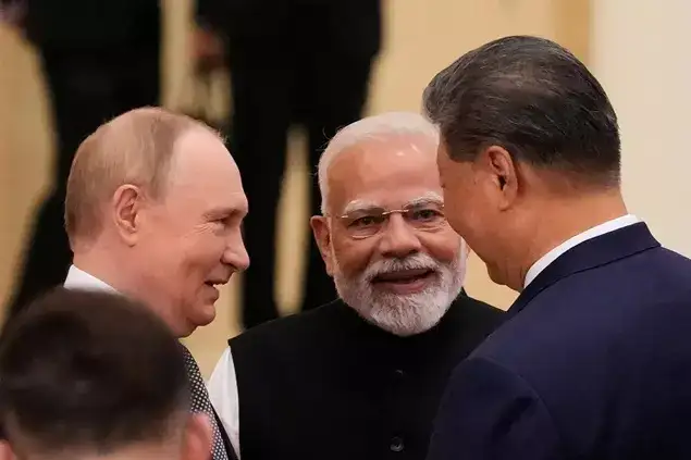 Russian President Vladimir Putin, from left, PM Modi and Xi Jinping talk ahead of the Shanghai Cooperation Organization (SCO) summit at the Meijiang Convention and Exhibition Center in Tianjin, China, Monday, Sept. 1, 2025.